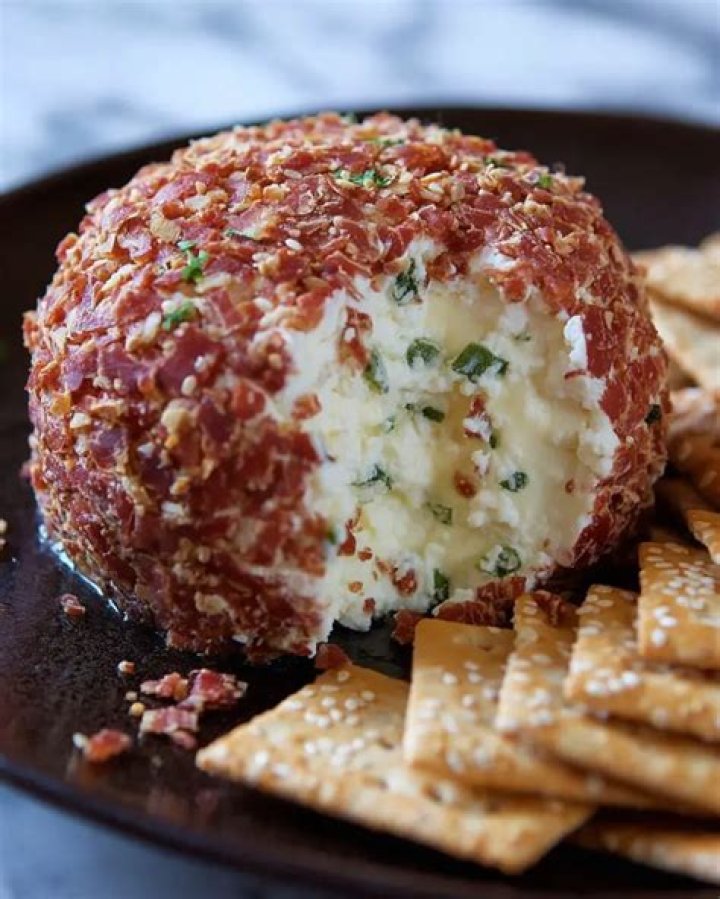 Cheese ball coated with dried cherries and pecans.